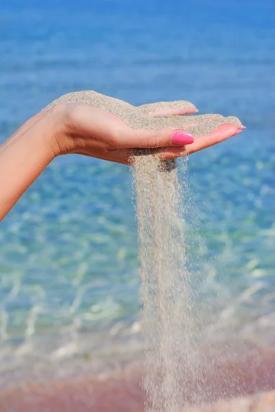 Sand pour away through the hands - time concept — Stock Photo, Image