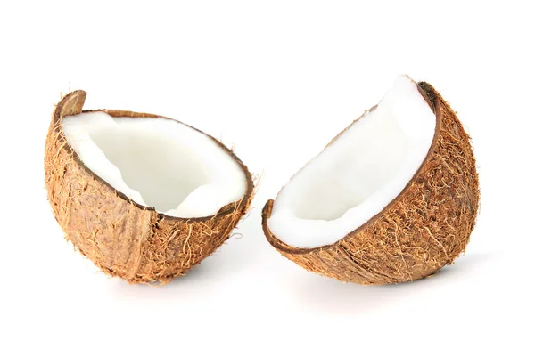 Dos mitades de coco con leche aislada sobre blanco — Foto de Stock