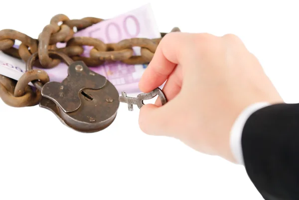 Money security concept - hand with key try to unlock money - iso — Stock Photo, Image