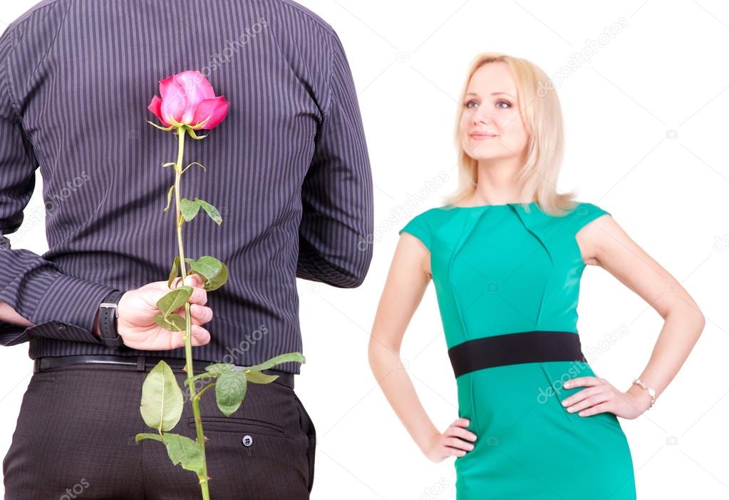 loving couple - man with rose surprise for his woman