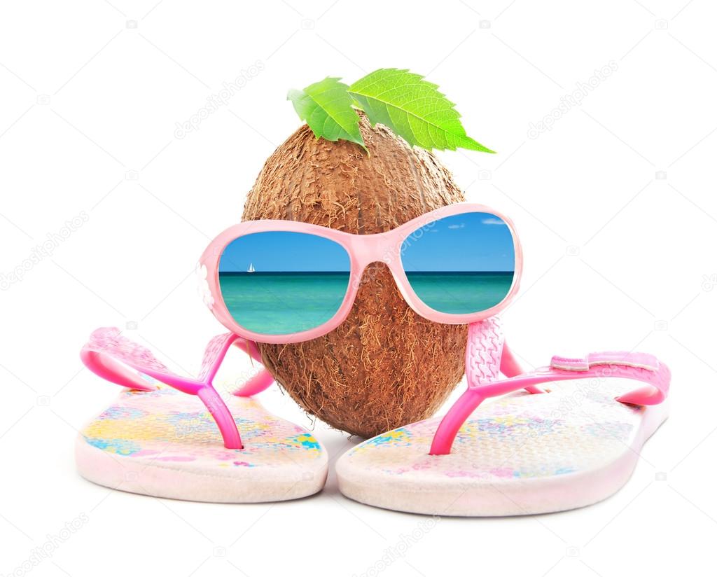 coconut concept for travel agency with sunglasses and beachwear