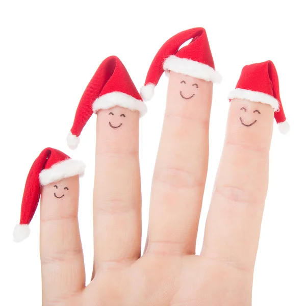 Las caras de los dedos en los sombreros de Santa. Feliz familia celebrando concepto fo —  Fotos de Stock