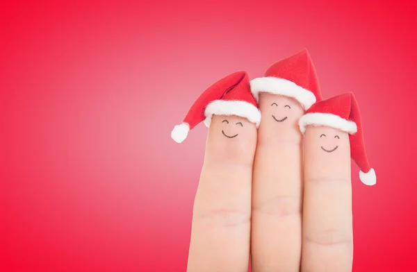 Caras de dedos en sombreros de Santa — Foto de Stock