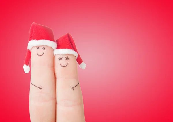 Fingers faces in Santa hats — Stock Photo, Image