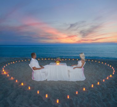 couple at beach romantic dinner with candles heart clipart