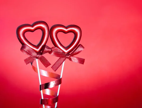 Two red valentine hearts with bows — Stock Photo, Image