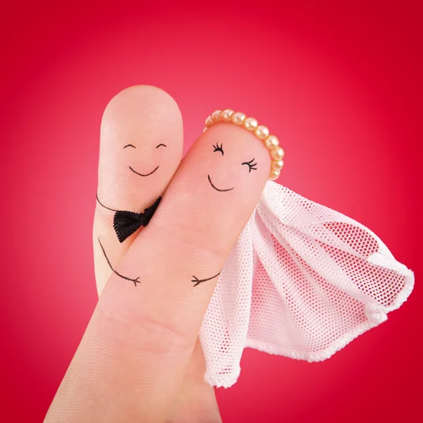 Newlyweds painted at fingers — Stock Photo, Image