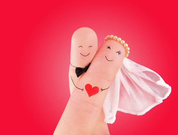 Newlyweds painted at fingers — Stock Photo, Image