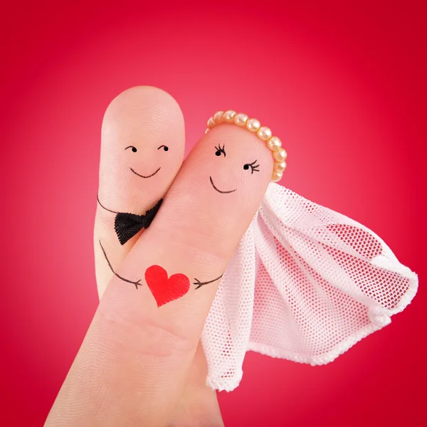 Newlyweds painted at fingers — Stock Photo, Image