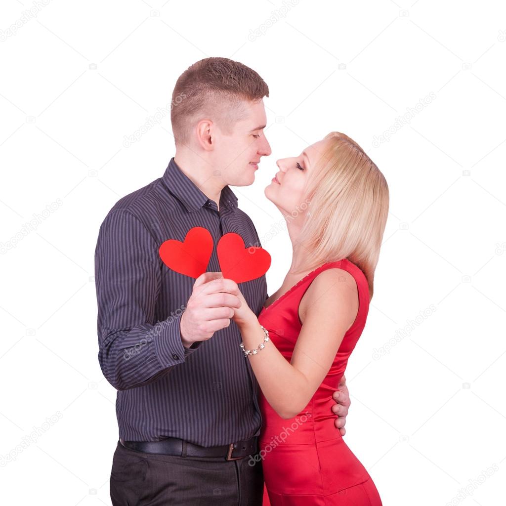 Loving couple with two hearts isolated on white