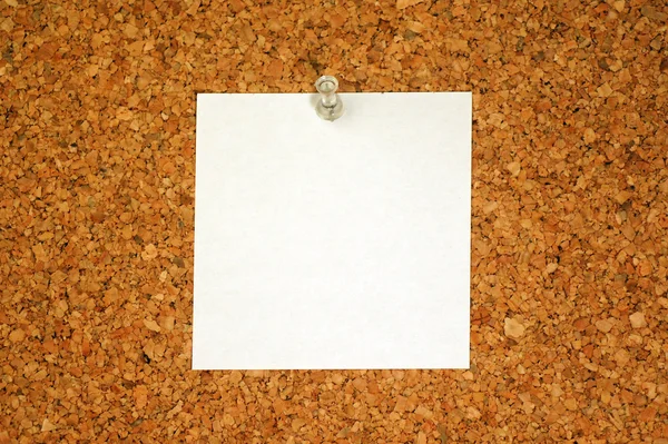 white blank paper for your text on cork background
