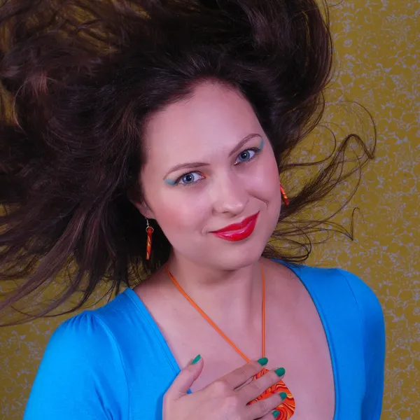 Colorful portrait about woman with flying hair — Stock Photo, Image