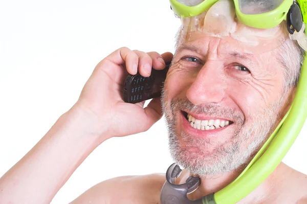 Smiling skin diver has a call on his cell phone — Stock Photo, Image