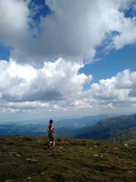 woman hiking in summer mountains