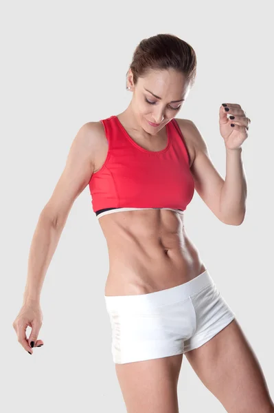 Athletic woman isolated on white background — Stock Photo, Image