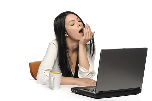 Bored business woman working on laptop looking very boring at the computer, Isolated white background — Stock Photo, Image