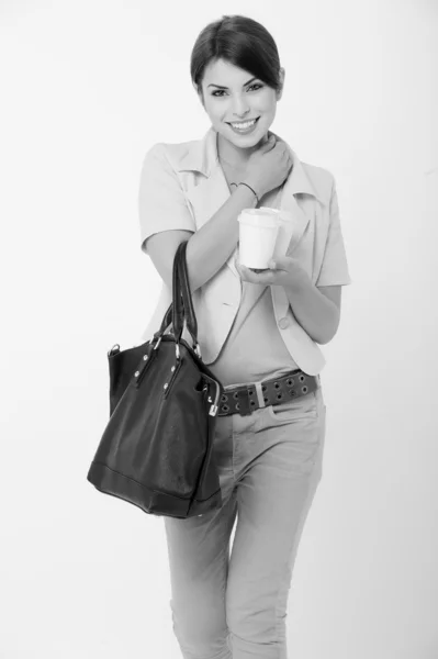 Businesswoman holding a coffee cup in her hand — Stock Photo, Image