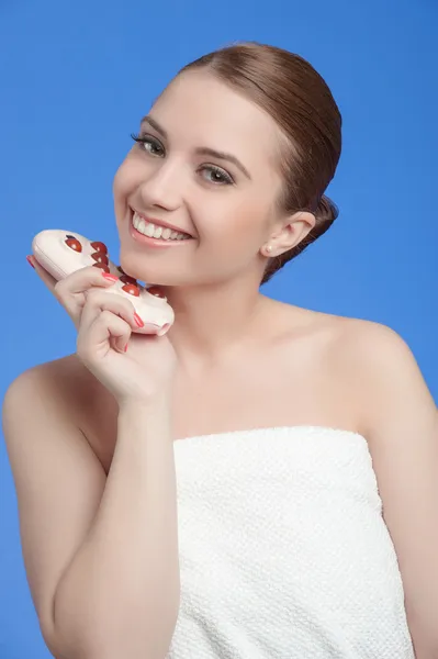 Relaxed young female getting a stone massage in a spa — Stock Photo, Image
