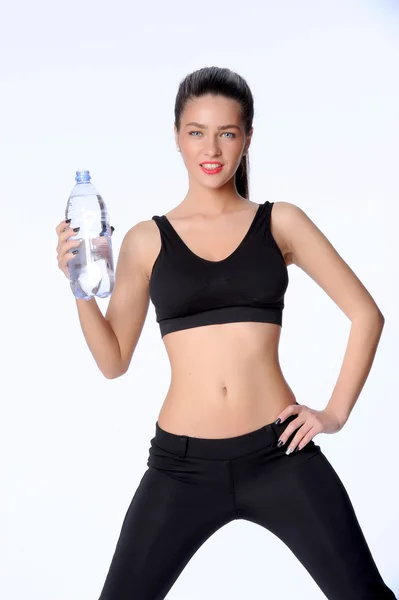 Mulher jovem hidratante após o exercício — Fotografia de Stock