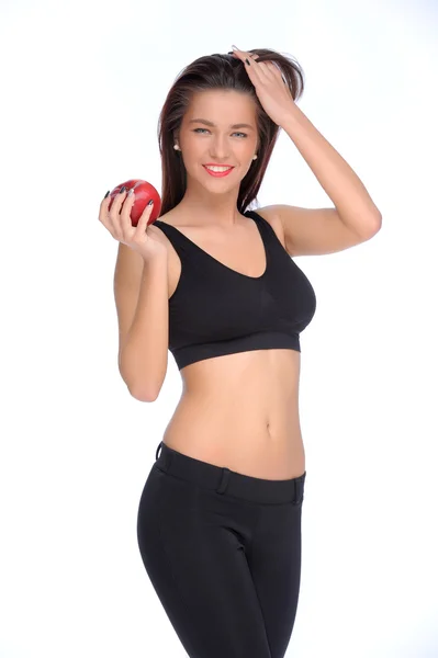 Милая юная леди держит красное яблоко в изоляции — стоковое фото