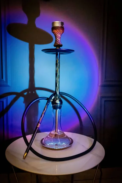 Smoke luxury hookah in lounge bar.