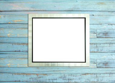 SilveVintage picture frame on blue wood background