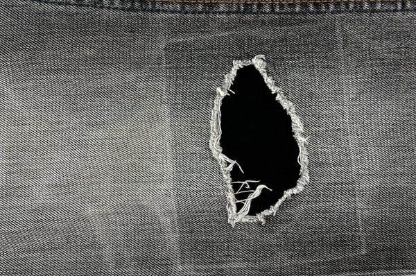 Detail of torn Blue denim, front view jean — Stock Photo, Image