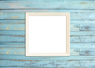 Mavi ahşap zemin üzerinde beyaz vintage fotoğraf çerçevesi