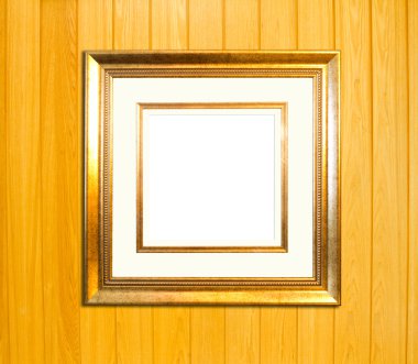 ahşap zemin üzerine altın antika resim çerçevesi