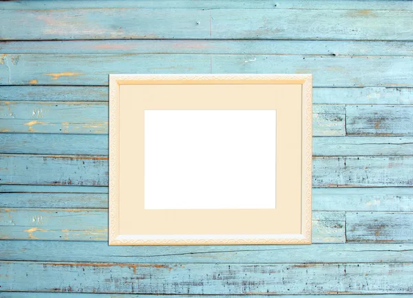 Vintage picture frame on blue wood background — Stock Photo, Image