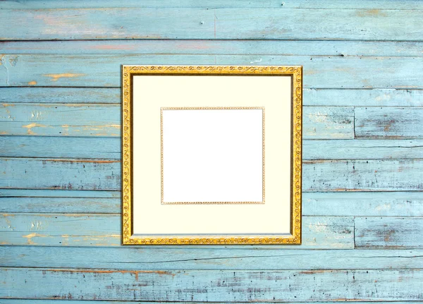 Gold Vintage picture frame on blue wood background — Stock Photo, Image