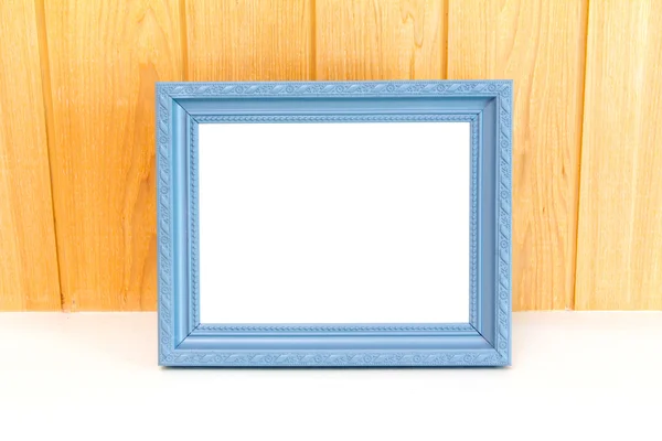 Gray Vintage picture frame on wood background — Stock Photo, Image