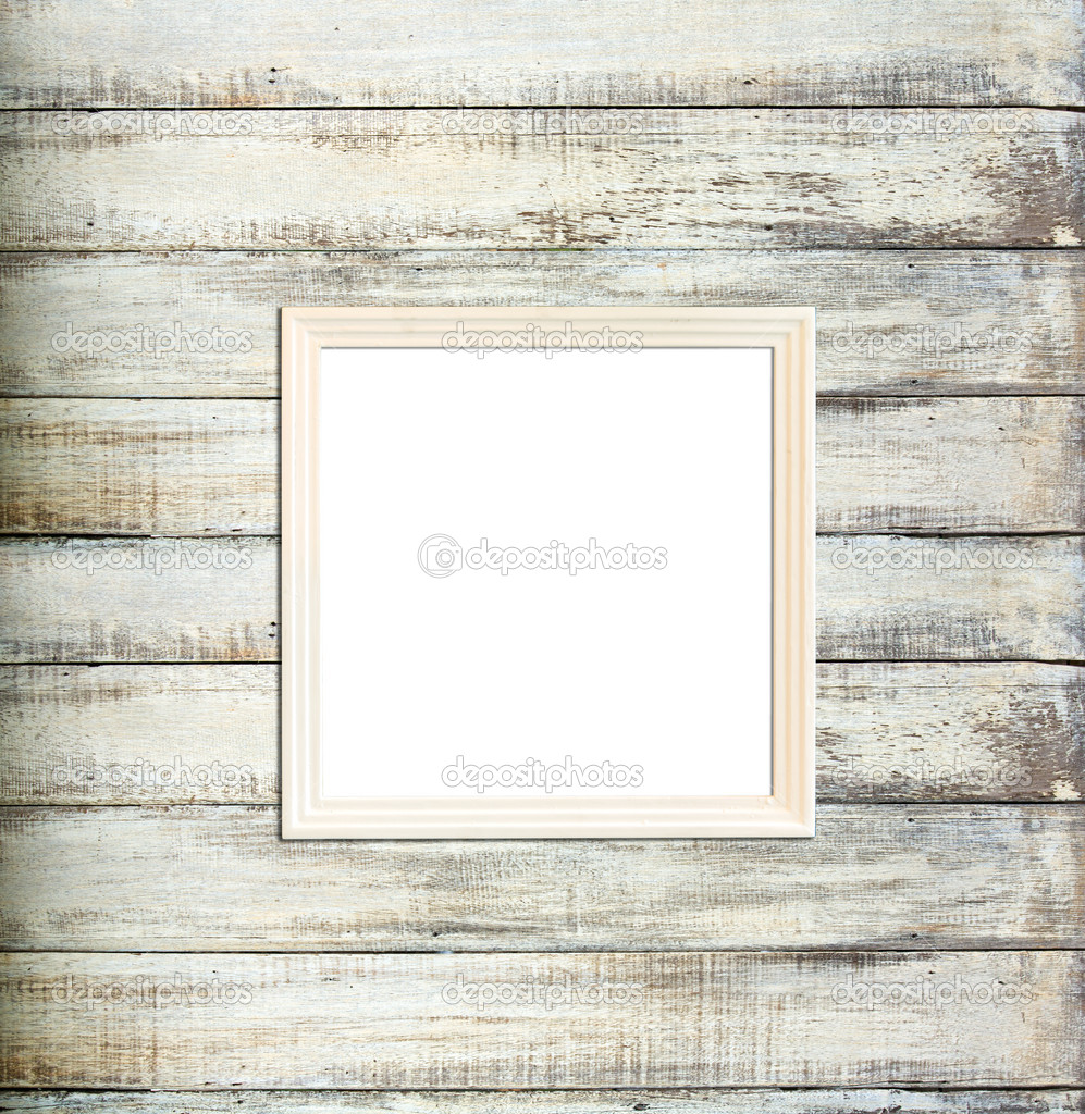 White Vintage picture frame on old wood background