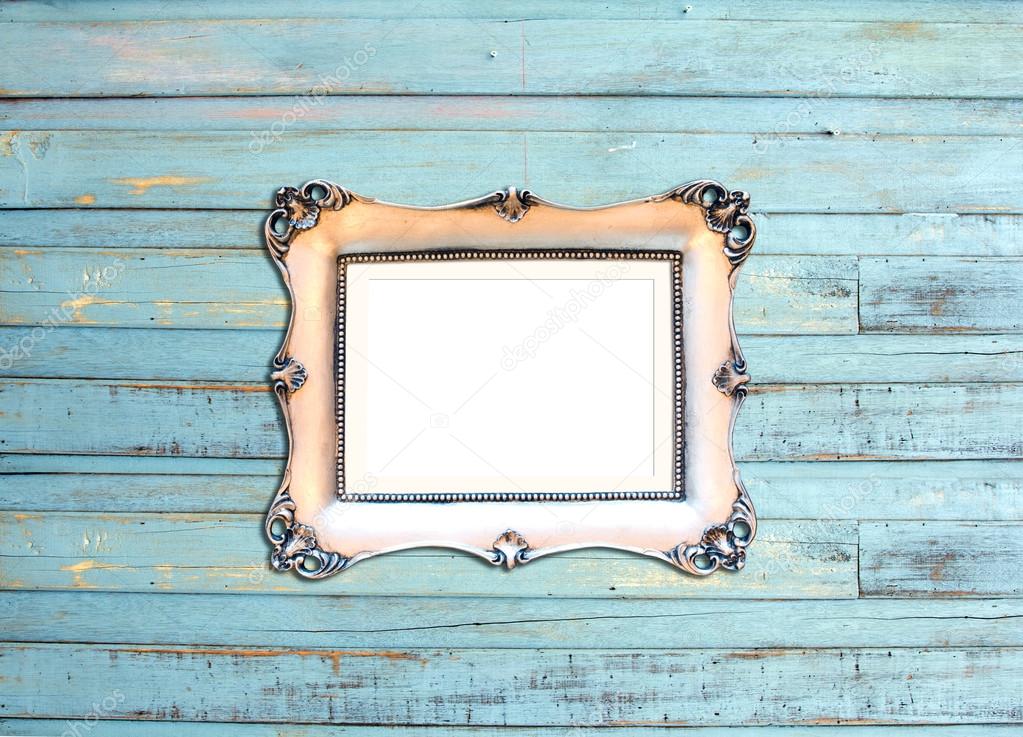 Silver Vintage picture frame on blue wood background