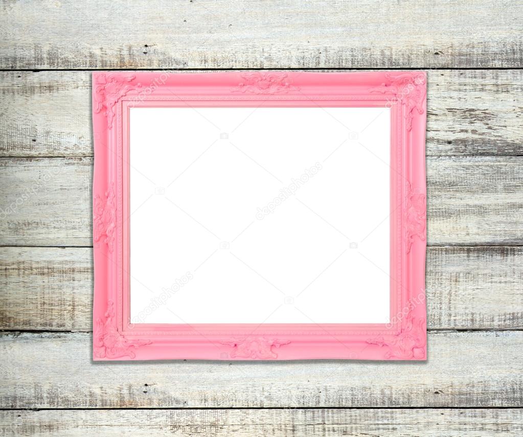 Pink Vintage picture frame on blue wood background