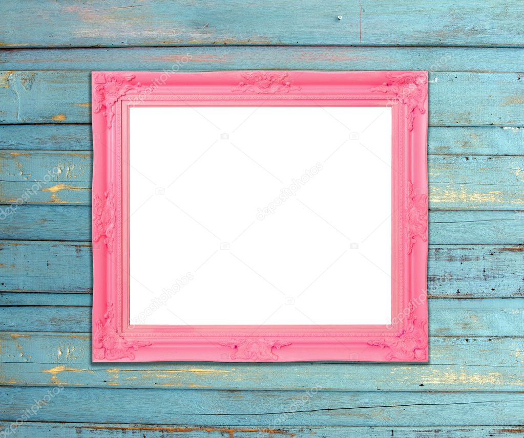 Pink Vintage picture frame on blue wood background