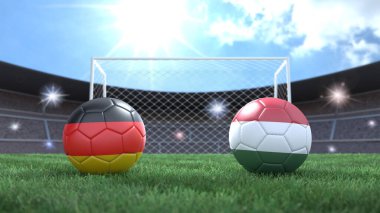 Stadyumdaki bayraklı iki futbol topu bulanık arka planda. Almanya ve Macaristan. 3d resim