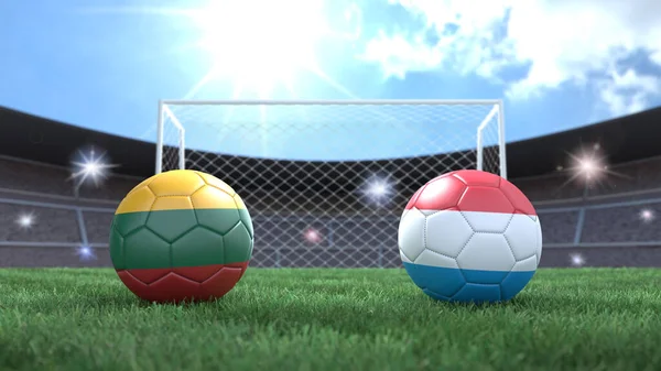 Two soccer balls in flags colors on stadium blurred background. Lithuania and Luxembourg. 3d image