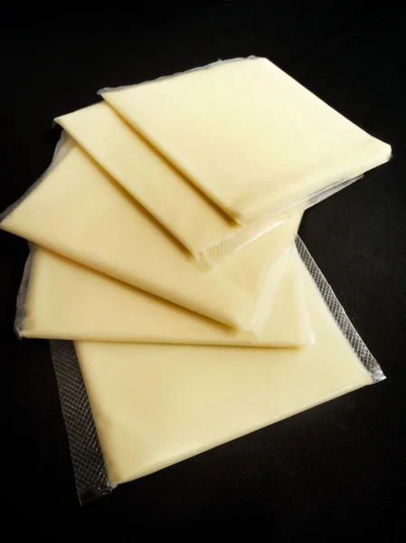Rebanadas de queso americano —  Fotos de Stock
