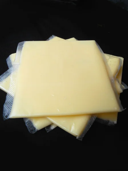 Fatias de queijo americano — Fotografia de Stock