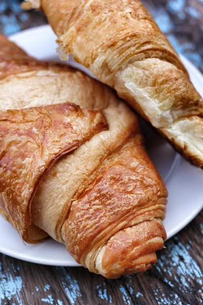 Croissant a šálek kávy — Stock fotografie