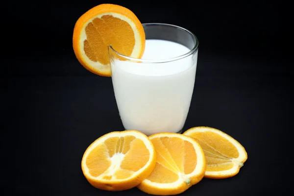Milk with orange fruit — Stock Photo, Image