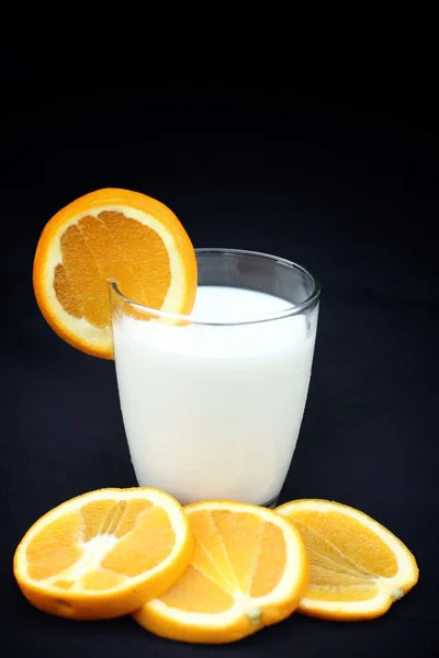 Milk with orange fruit — Stock Photo, Image