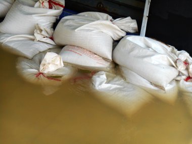 White sandbags for flood defense clipart