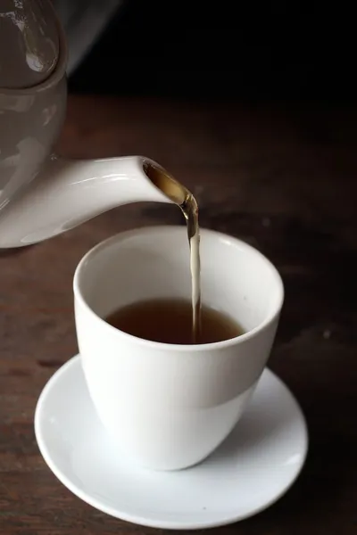 Hot tea on the wood background — Stock Photo, Image