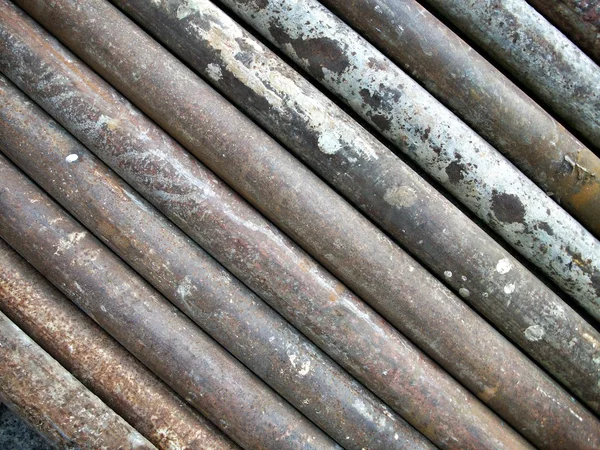 Old iron pipes stacked — Stock Photo, Image