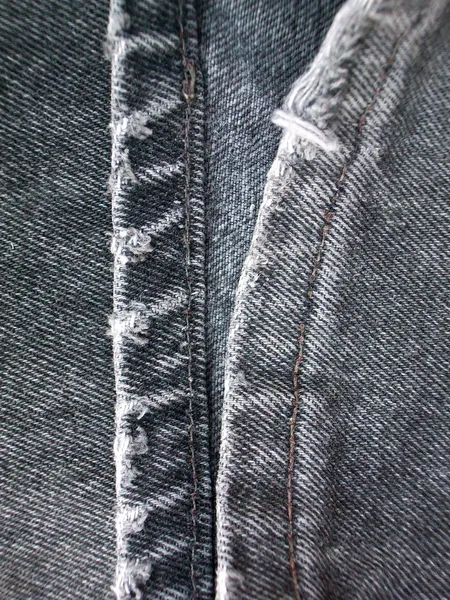 縫い目の背景を持つジーンズ — ストック写真
