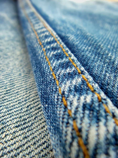 Jeans vintage con costuras de fondo — Foto de Stock