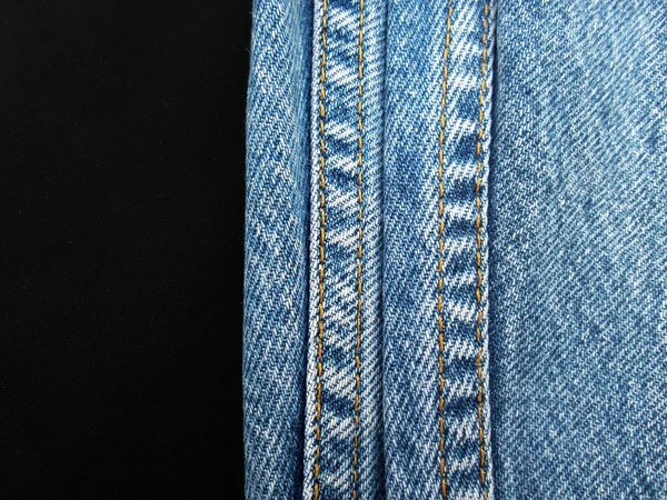 Jeans vintage com costuras fundo — Fotografia de Stock