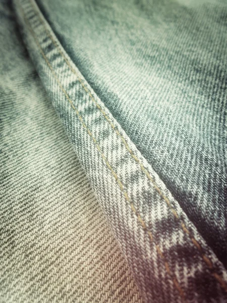 Jeans vintage con costuras de fondo — Foto de Stock